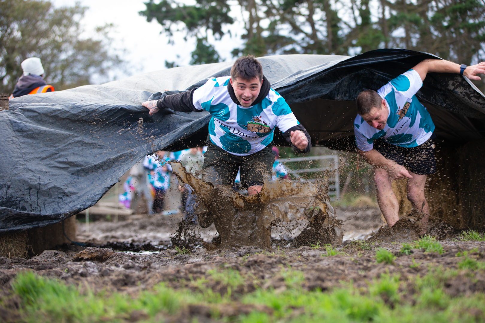 Out in the muddy fields, cow-patterned runners can’t stop smiling